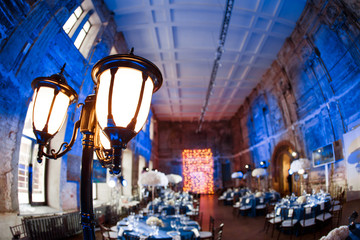 Wedding. Banquet. The chairs and round table for guests, served with cutlery and crockery and...