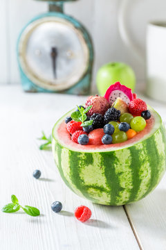 Exotic fruits salad in watermelon in summer day