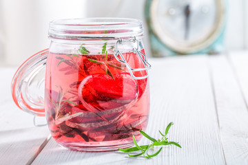 Healthy water in jar with beetroot and rosemary