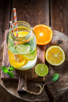 Fresh water with citrus fruits and mint leaves