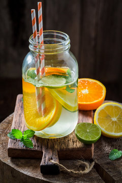 Sparkling water with mint leaves and citrus fruits