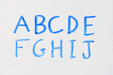 blue white board alphabet A - J