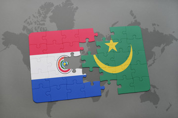 puzzle with the national flag of paraguay and mauritania on a world map