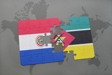 puzzle with the national flag of paraguay and mozambique on a world map