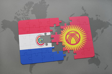 puzzle with the national flag of paraguay and kyrgyzstan on a world map