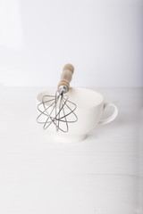 Whisk on the white cup