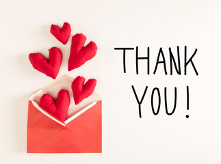 Thank You message with red heart cushions