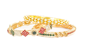 Gold bracelets with gem and diamonds isolate on white background.