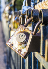 ancient castle that hangs on a metal fence
