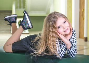 Girl lying on a couch.