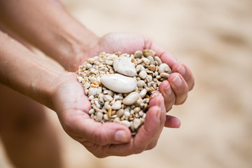 Woman palms holding pebble