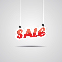 Sale Sign Hanging On Gray Background.