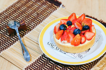 mini strawberry pie on dish and spoon 