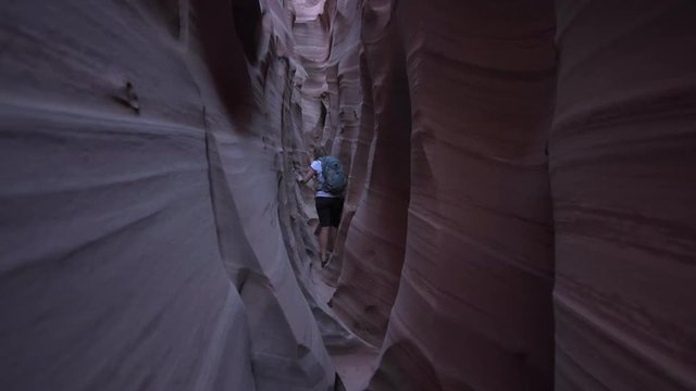 Backpacker Girl exploring Zebra Slot Canyon Escalante Utah