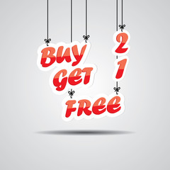 Buy 2 get 1 free Sign Hanging On Gray Background.