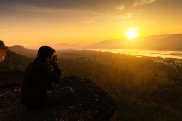 Tourists photograph with the sunrise