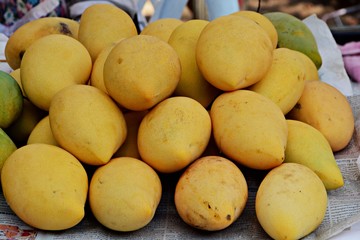 The mangoes were sold by market vendors in Thailand.