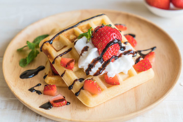 waffle with strawberry on wood