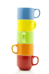 stack of colorful coffee cups isolated on white background.