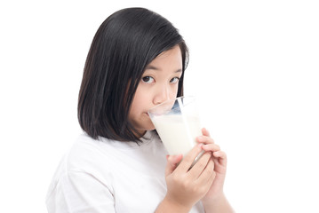 Asian Girl drinking milk from a glass on white background