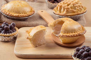 pie and tart with coconut filling on the wooden background - soft focus