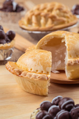 pie and tart with coconut filling on the wooden background - soft focus