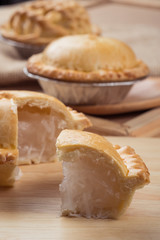 pie and tart with coconut filling on the wooden background - soft focus