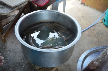 Terengganu, Malaysia - January 1, 2016: Process of making Lekor, a traditional food that is popular in East Coast Malaysia.