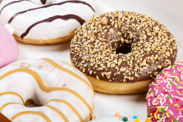 glazed donuts with different fillings in the box