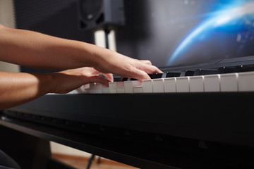 Fototapeta premium female's hands playing piano
