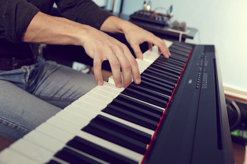 Playing the piano keyboard close up