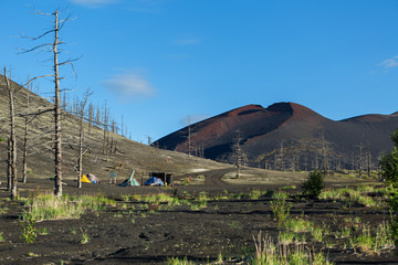 Campground near remains of a helicopter brought down and buried in the eruption of Tolbachik...