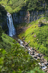 Waterfall Spokoyny in brookvalley at the foot of outer north-eastern slope of caldera volcano Gorely.
