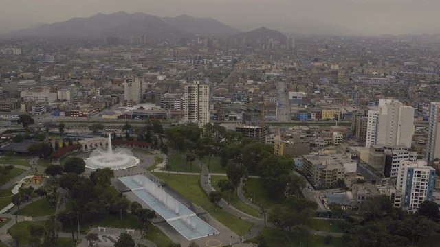 Lima Peru Aerial v14 Flying low over Reserve Park panning with stadium and cityscape views.
