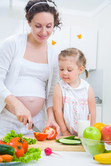 mother with daughter at kitchen