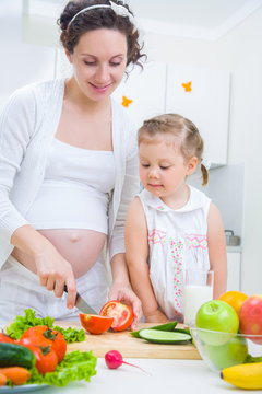 mother with daughter at kitchen