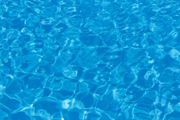 Blue and bright water with sun reflection