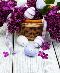 easter eggs and fresh lilac flowers