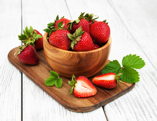 ripe strawberries on wooden table