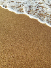 Sand and wave at the beach background