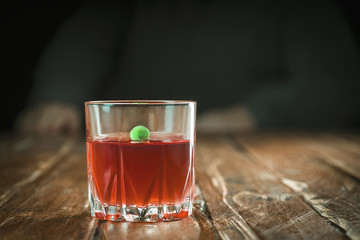 Tablet in a drink on the background of man