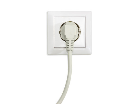 White socket outlet with connected corresponding power plug