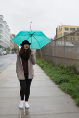 Asian Woman Holding Umbrella While Raining