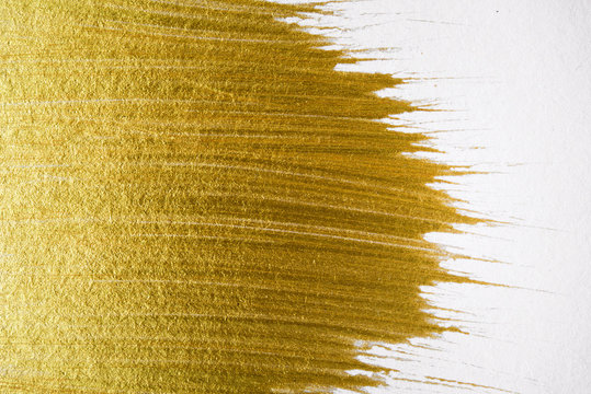 Gold acrylic paint texture on white paper background art object design