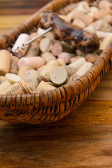 wine corks in a old basket bread on rosewood timber