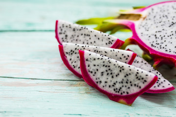 Dragon fruit, pitaja exotic fruit on wooden background. 
