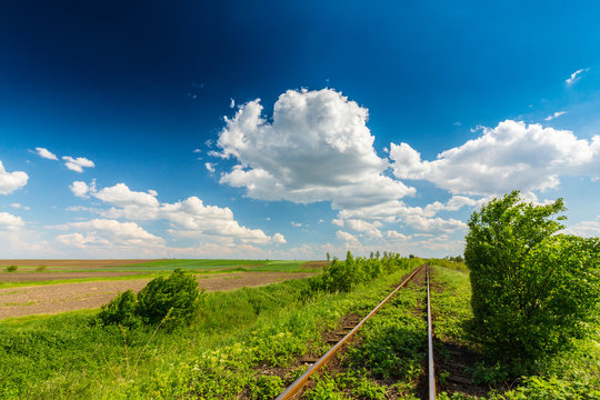 Scenic railroad in remote rural area in spring, in Eastern Europe