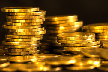 Close up gold money coin stacking on dark background