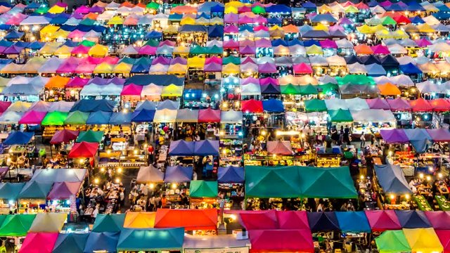  Night market with colorful tent.