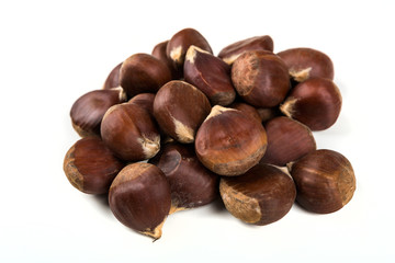 Raw organic chestnuts isolated on a white background